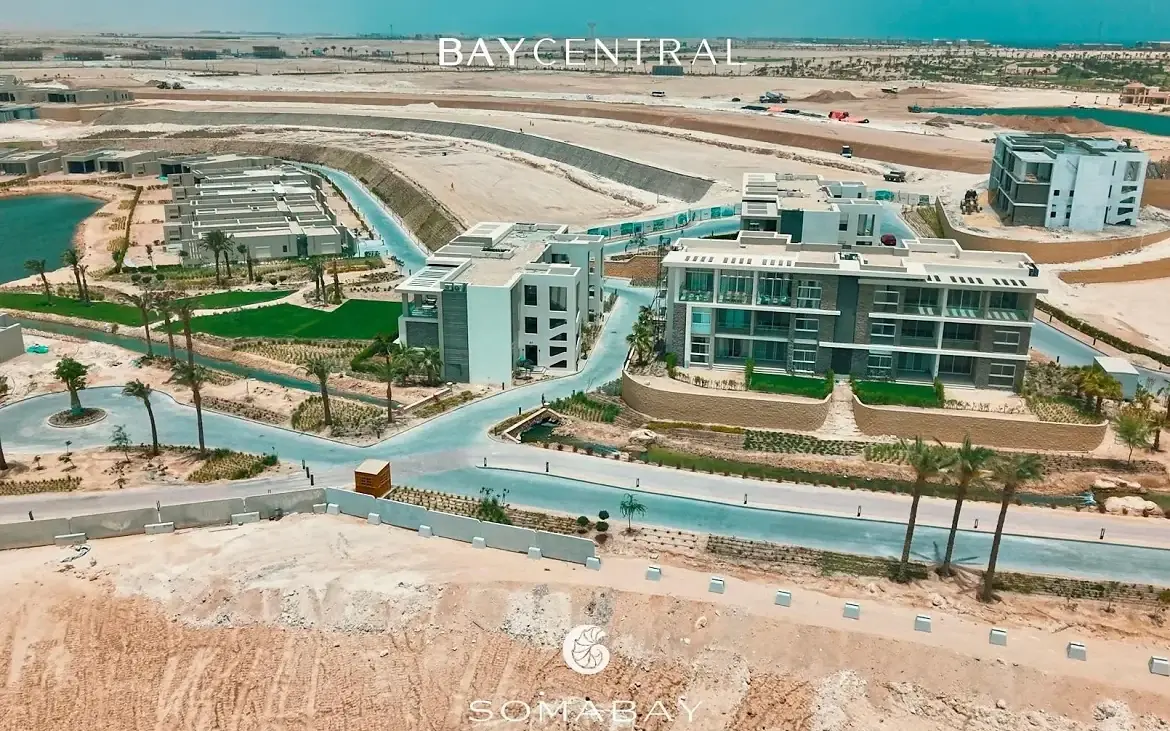 Soma Bay, Bay Central — aerial view of low-rise residential blocks, landscaped terraces and lagoon frontage on the Red Sea coast