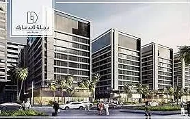 Degla Landmark — mid-rise development with horizontal banding and street-level frontage