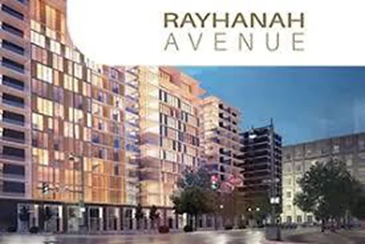 Rayhana Avenue — mixed-use avenue development at dusk
